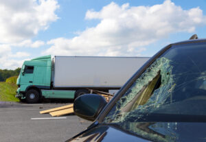 View of truck in an accident with car View of truck in an accident with car