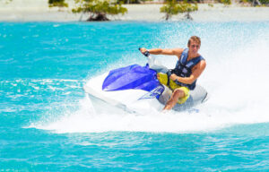 Man on Jet Ski having fun in Ocean Man on Jet Ski having fun in Ocean